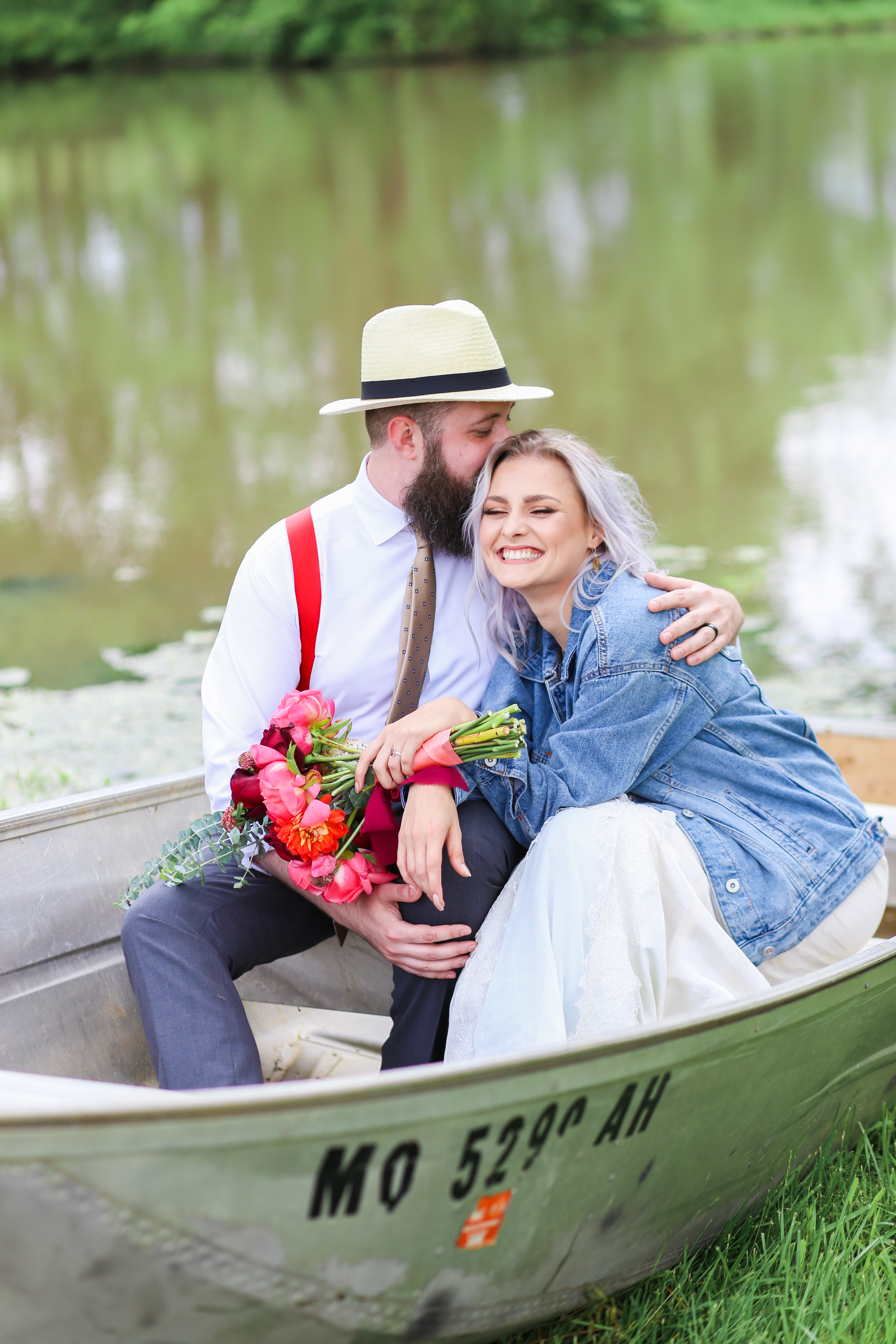 boho wedding on a canoe - laughing bride and groom - legacy at green hills - wedding photography at the legacy at green hills - Best Wedding Photographer - Kansas City Portrait & Wedding Photography - Mariam Saifan