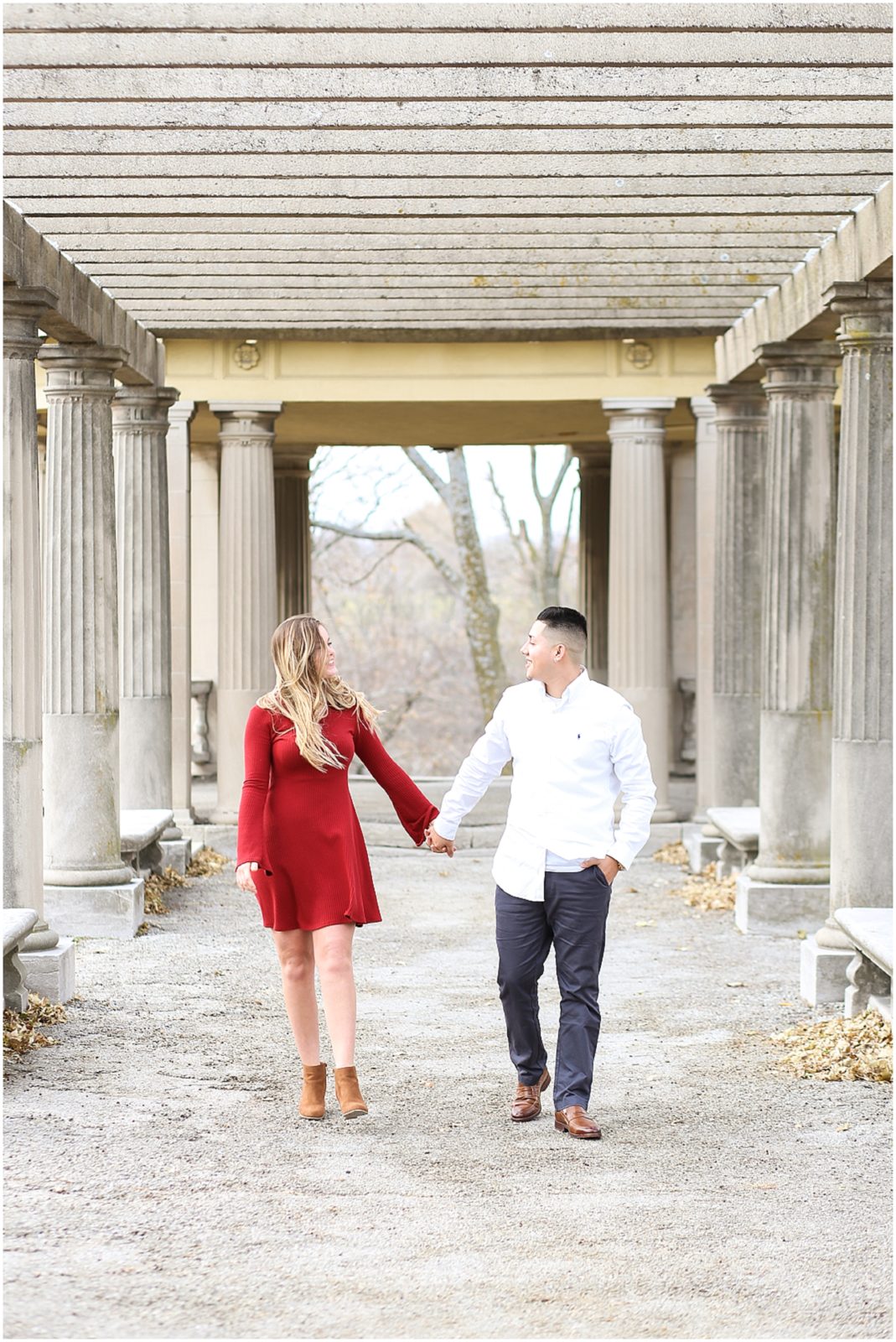 CUTE COUPLE WALKING AT COLONNADE IN KANSAS CITY - KANSAS CITY WEST BOTTOMS ENGAGEMENT PORTRAITS WITH MARIAM SAIFAN PHOTOGRAPHY - BEST WEDDING PHOTOGRAPHER IN KC - KANSAS CITY PORTRAIT AND WEDDING PHOTOGRAPHER - WEDDING AT BARN AT RIVERBEND