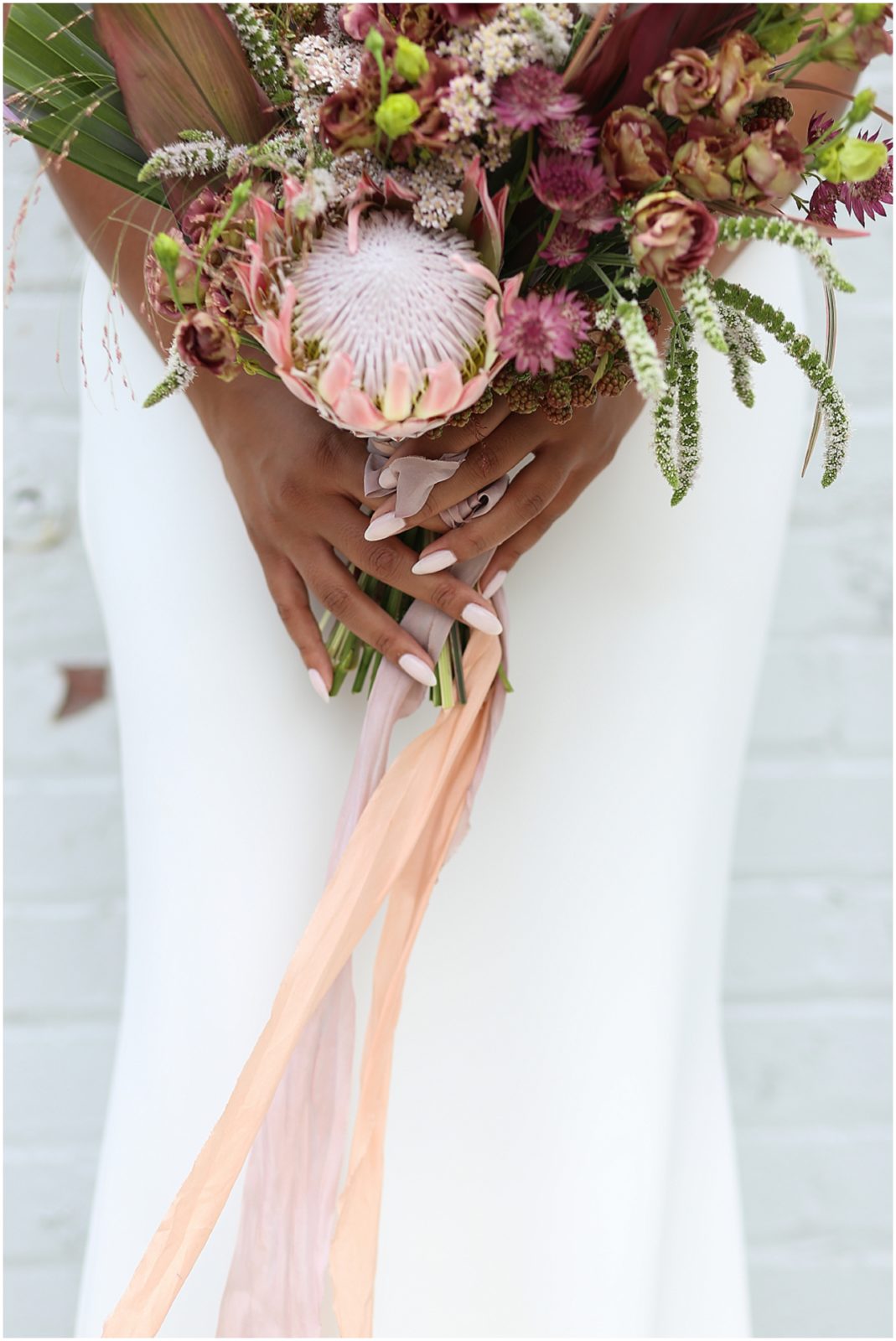 TROPICAL WEDDING FLOWERS WITH PINK NAILS ON A BRIDE AT THE HAVANA ROOM IN KANSAS CITY - MARIAM SAIFAN PHOTOGRAPHY