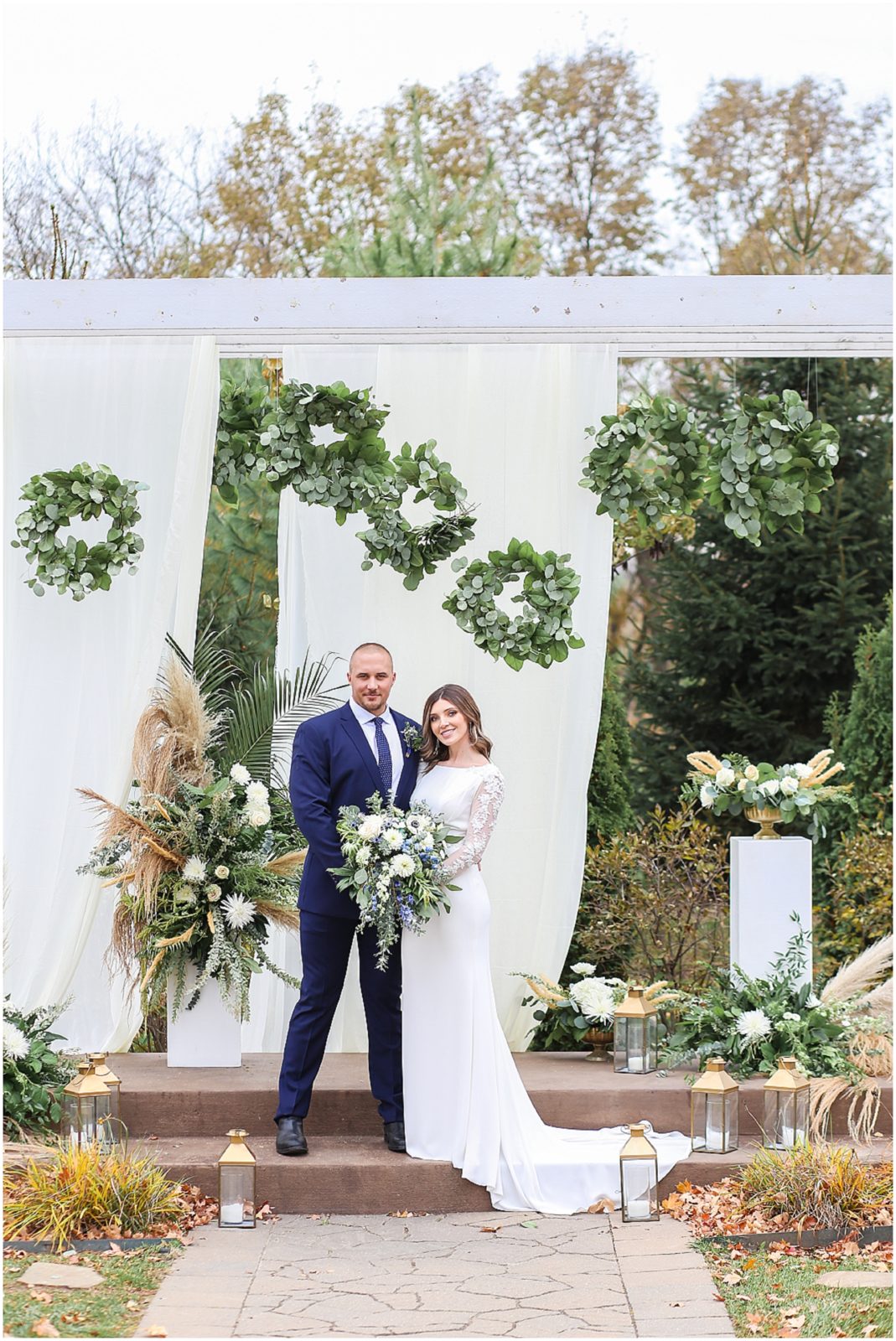 BRIDE AND GROOM AT ALTAR - Kansas City Wedding Venue - 1890 - The Fields at Eighteen Ninenty - Mariam Saifan Photography - Kansas City Portrait + Wedding Photographer - Wedding Planners in KC 