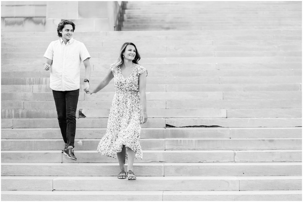 elegant image of bride and groom walking down the stairs - photo ideas for weddings - Kansas City STL Overland Park Leawood Wedding and Portrait Photographer | Mariam Saifan Photography | Luxury Weddings | Beautiful Engagement Portraits | Nelson Atkins Museum