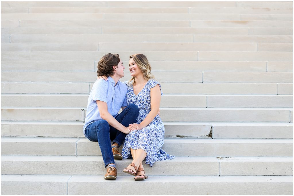 happy couple - outdoor engagement photos on the steps of the nelson atkins museum 