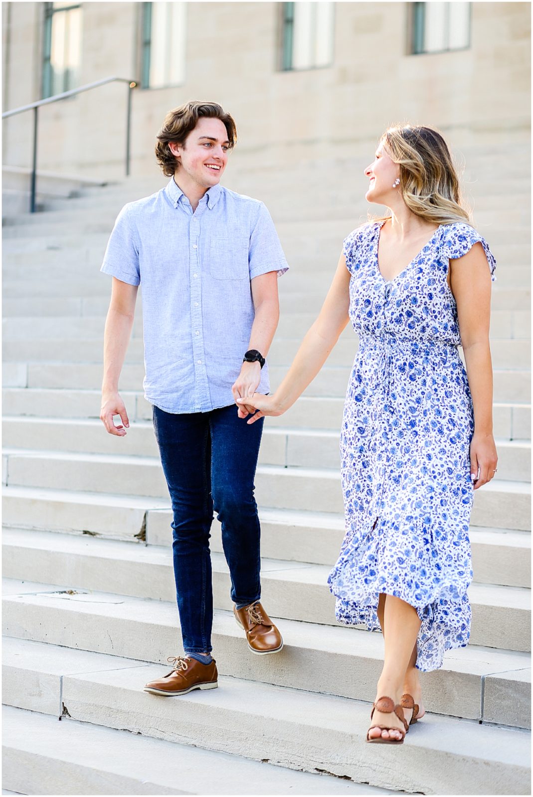 couple walking down stairs - wedding photos in kansas city - hawthorne house wedding photographer