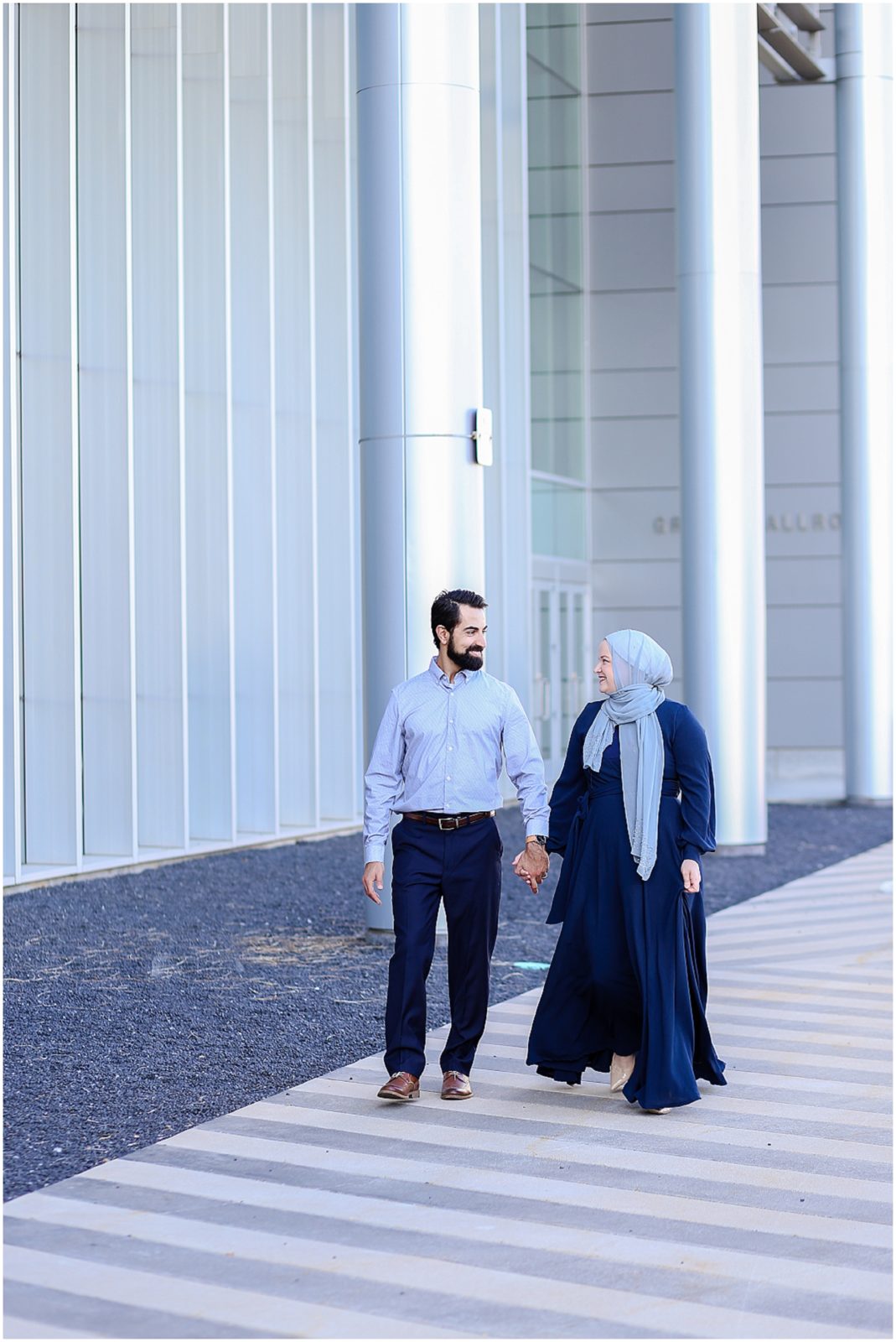 couple walking - Kauffman Center of Performing Arts Anniversary Session | Kansas City Crossroads Portraits and Engagement Session | Best Kansas City Portrait and Wedding Photographer | Wedding Photography by Mariam Saifan Photography | Wedding and Engagement Photo Locations in the Kansas City Area