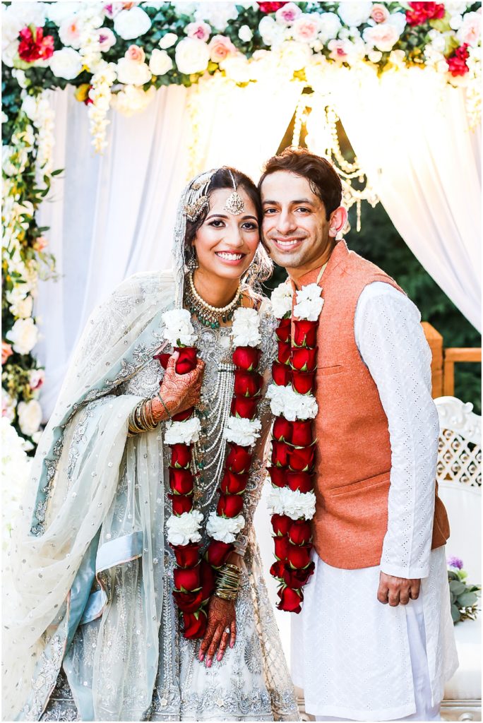 cute bride and groom with flowers 