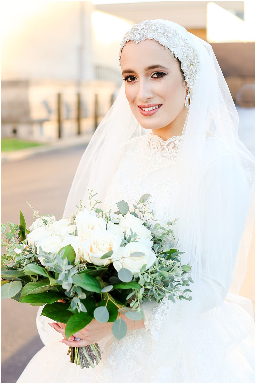 white floral bouquet - how to wear a wedding dress with hijab - long sleeve wedding dress - muslim arab bride 