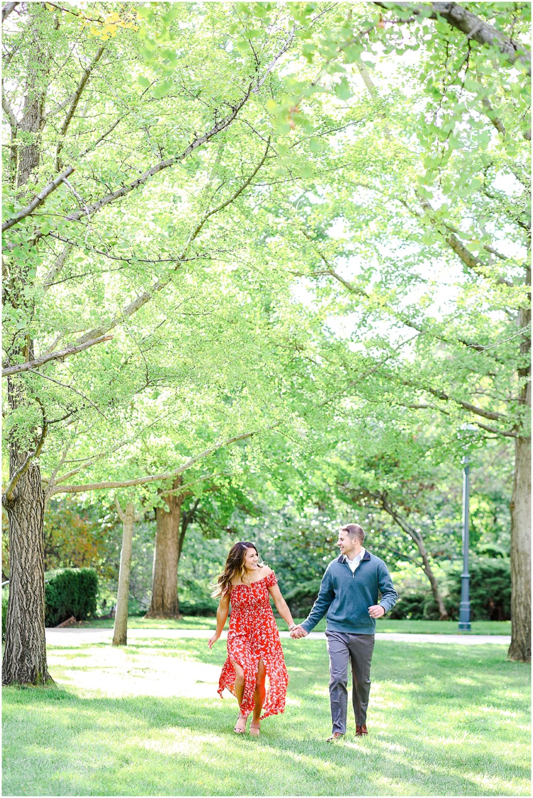 couple running for engagement photo