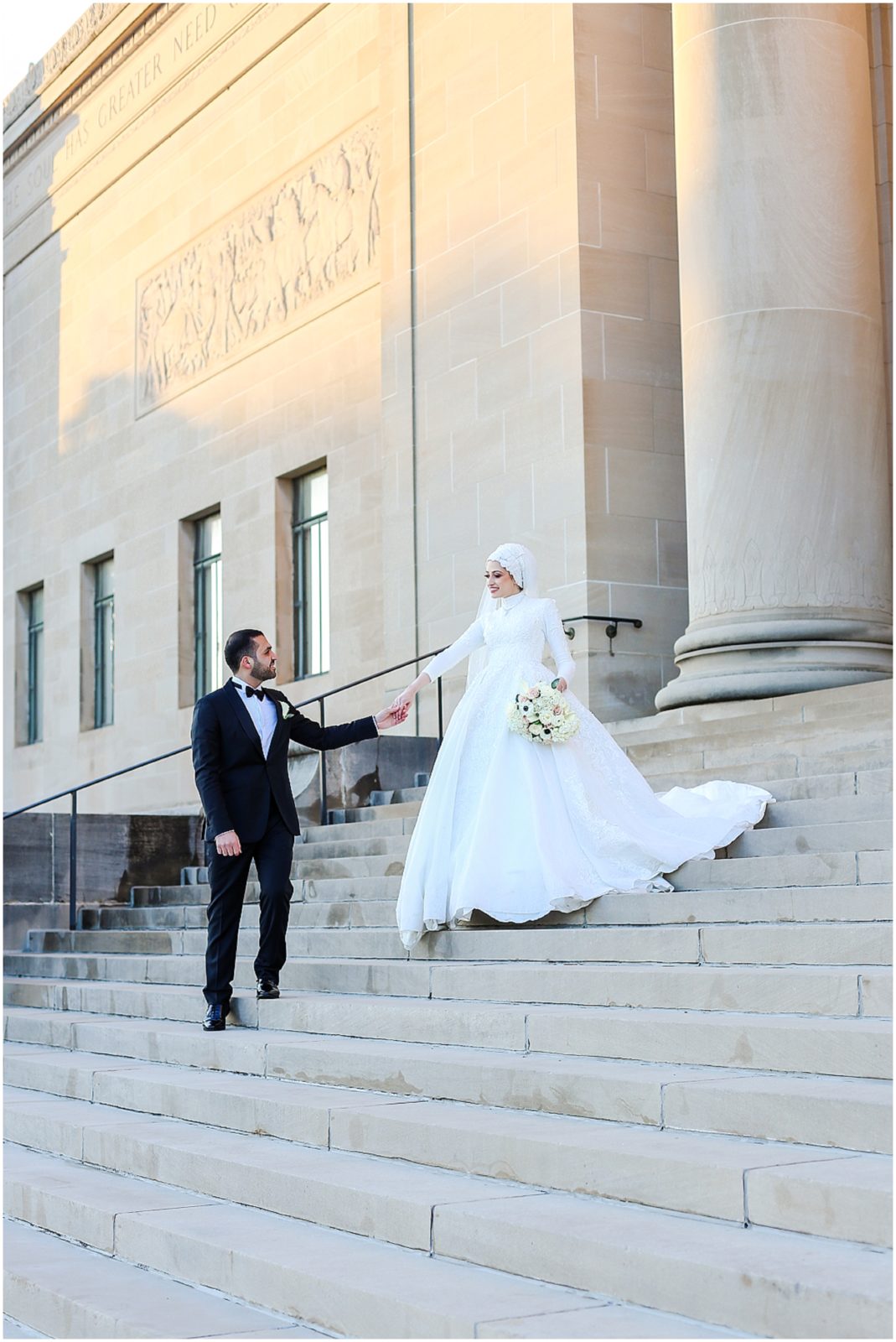 walking down the stairs holding hands wedding photos in kansas city