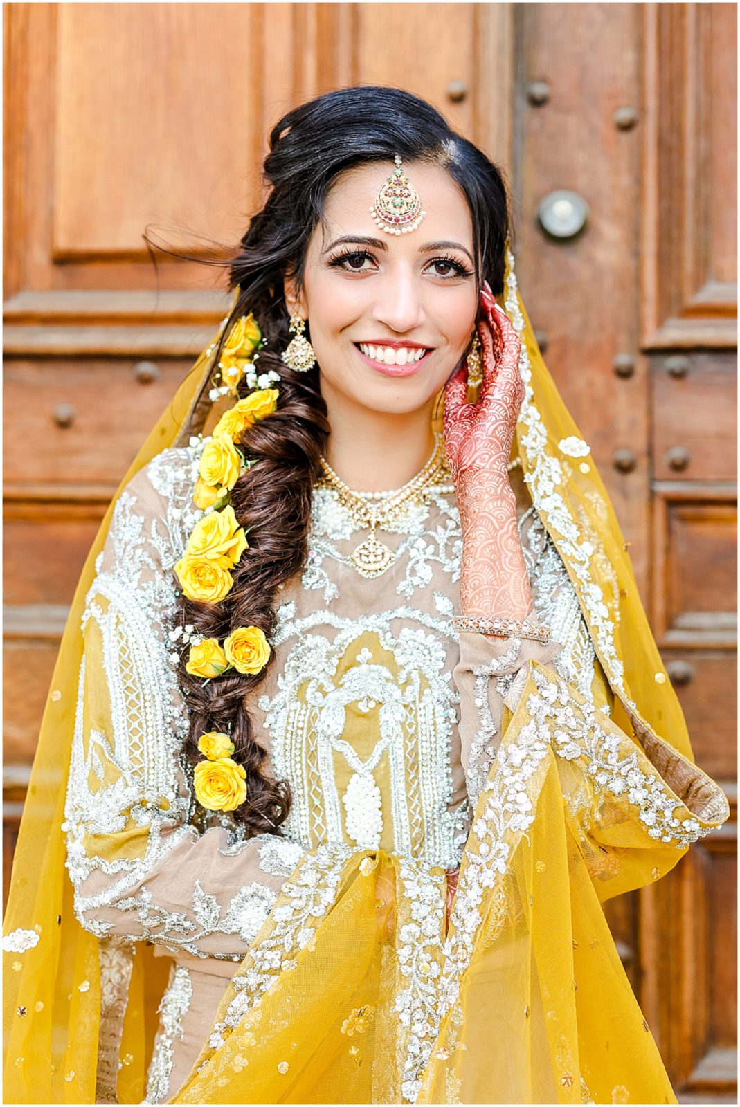 beautiful pakistani indian bride wearing yellow for her mehndi at the st.louis mo archway