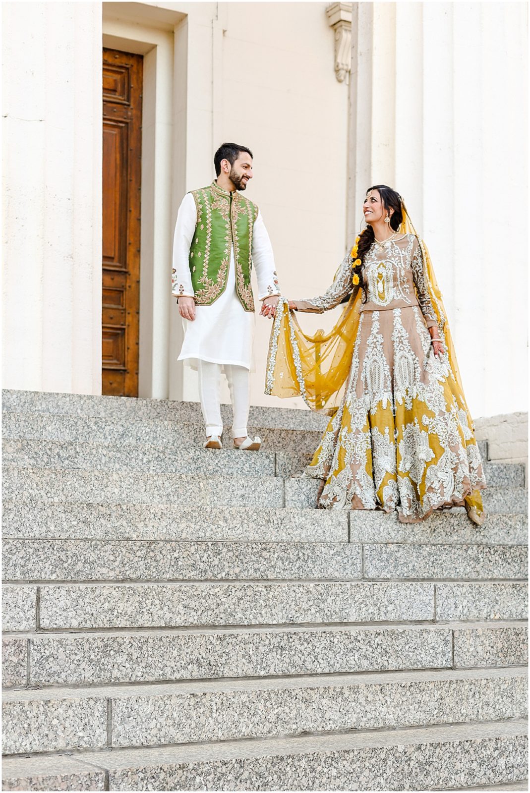 bride and groom walking down the stairs st.louis mo