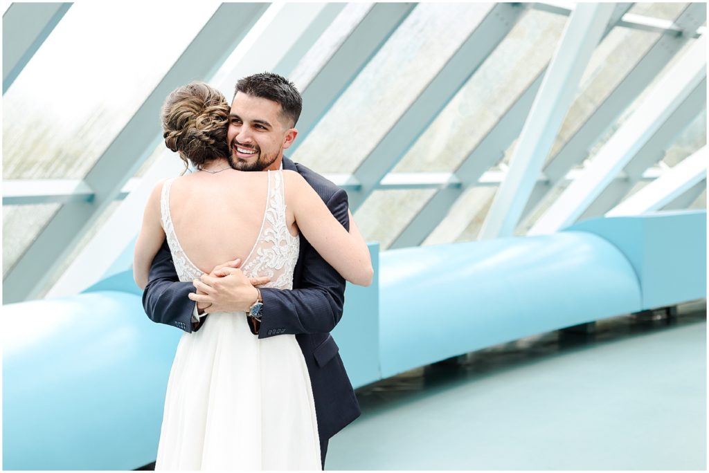 first look hug - Westin Crown Center Wedding Photos in Kansas City