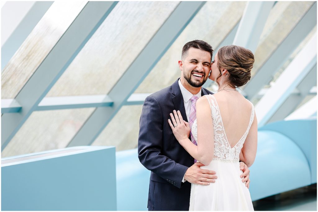 groom laughing - fun elopement wedding photos at kansas city crown center westin 