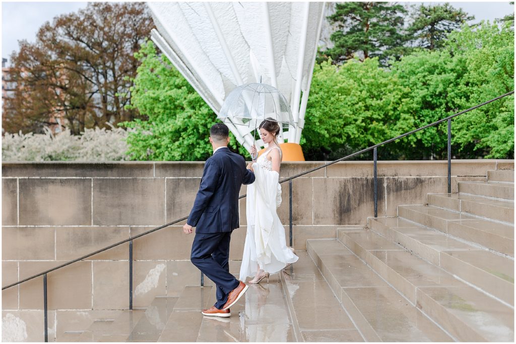 wedding couple walking down the stairs in kc