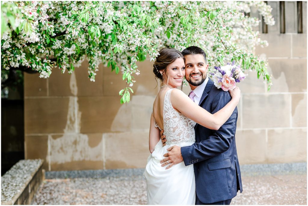 wedding couple hugging in the rain 