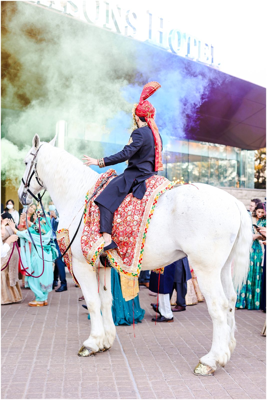 groom entry with horse - baraat - four seasons stl 
