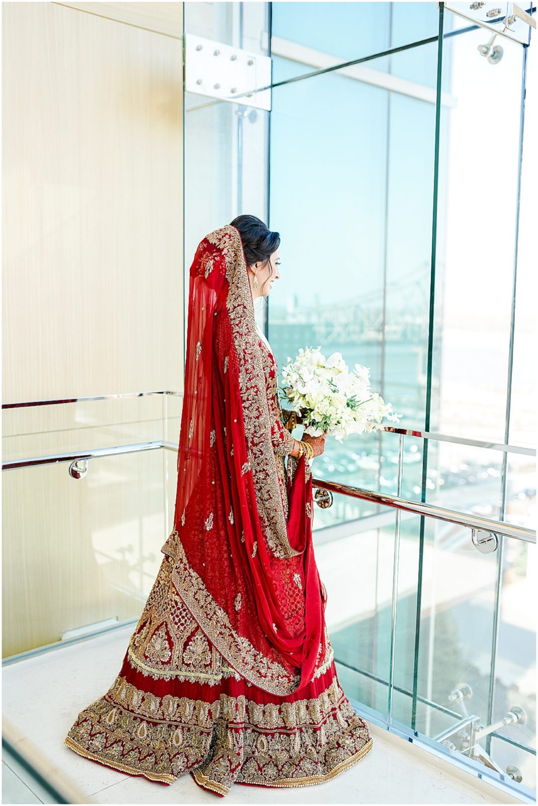 beautiful indian bride looking out the window - mariam saifan photography - best wedding photographer in st louis and kansas city 