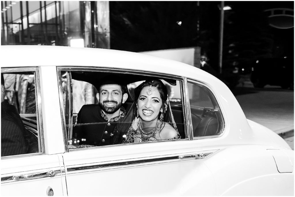 exit - bride and groom grand exit photos from four seasons hotel st. louis 