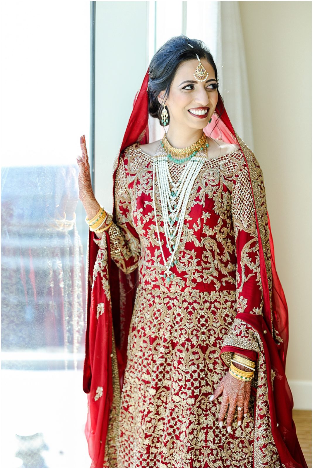 Kansas City Indian Fusion Wedding Photographer | Indian Bride looking outside the window for her getting ready portraits - 