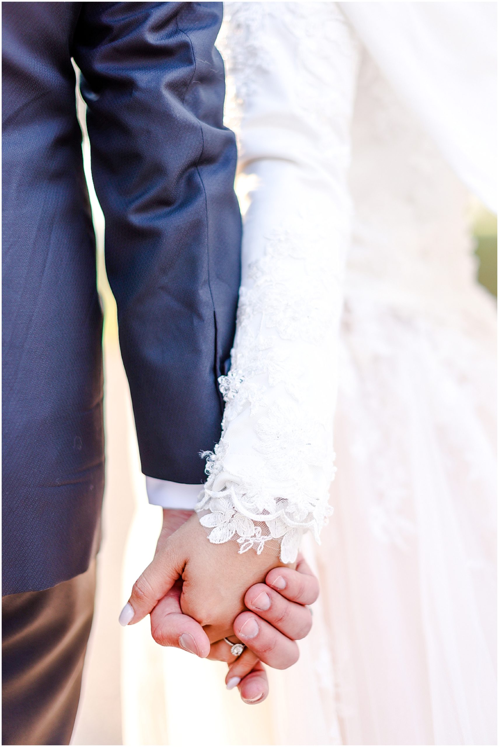 bride and groom holding hands