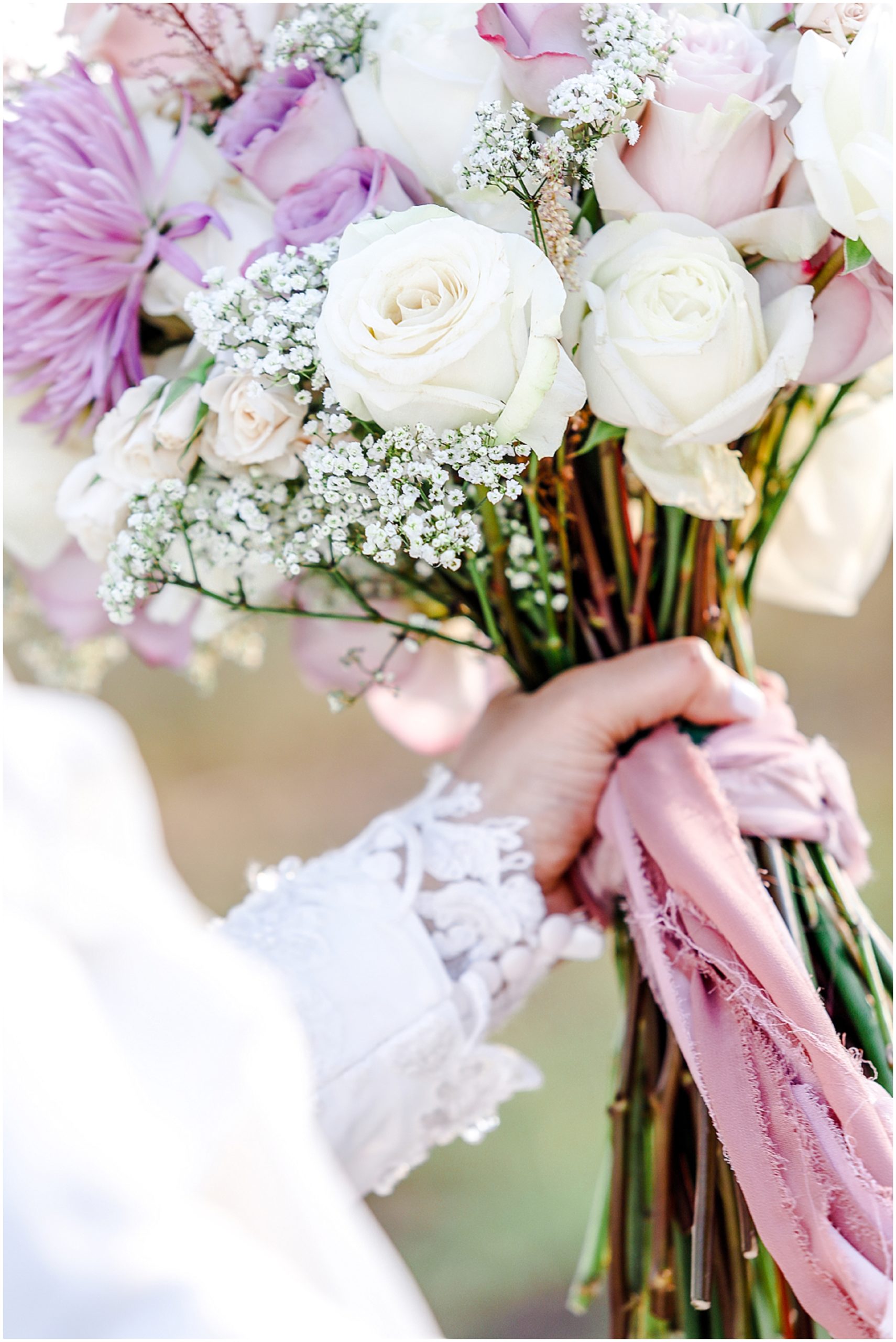 holding wedding bouquet 