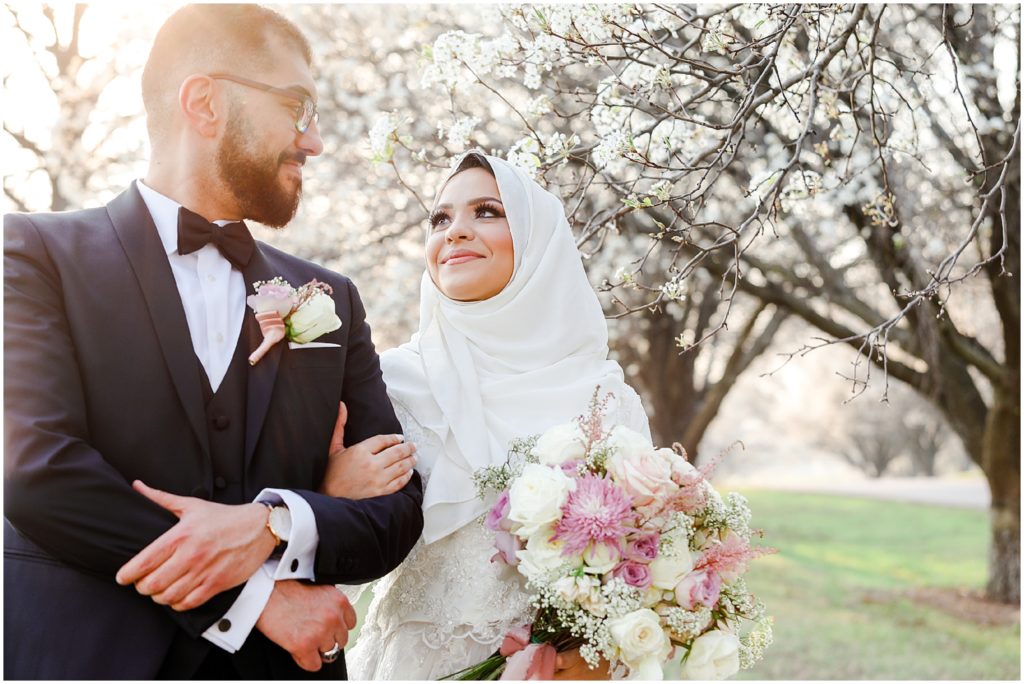 bride and groom looking at each other in love at shawnee mission park - muslim bride and groom wedding photos