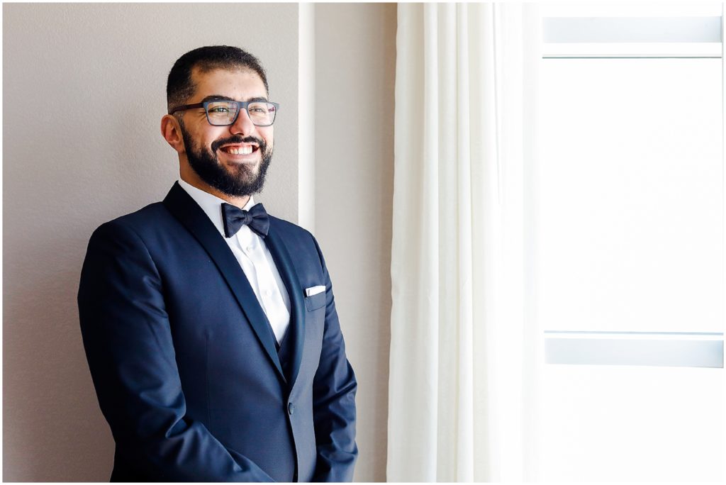 groom looking out window