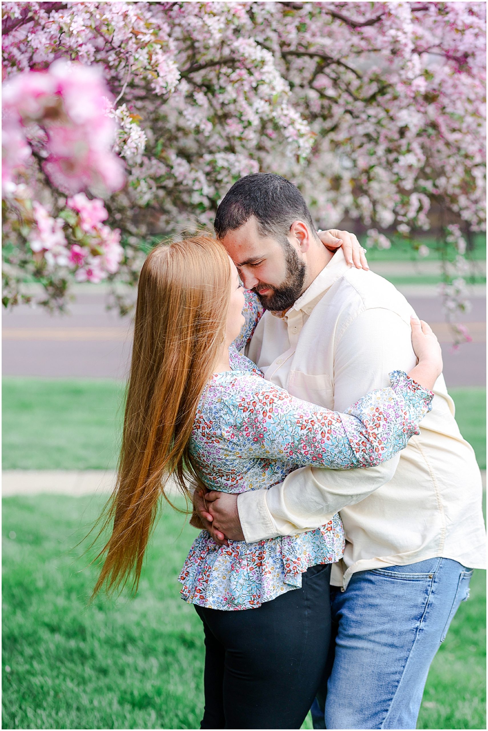 engagement photo under spring pink tree