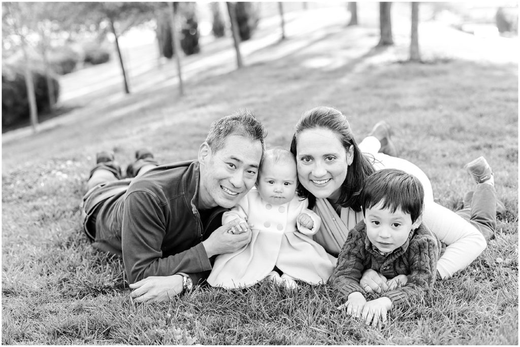 family laying on floor for photo