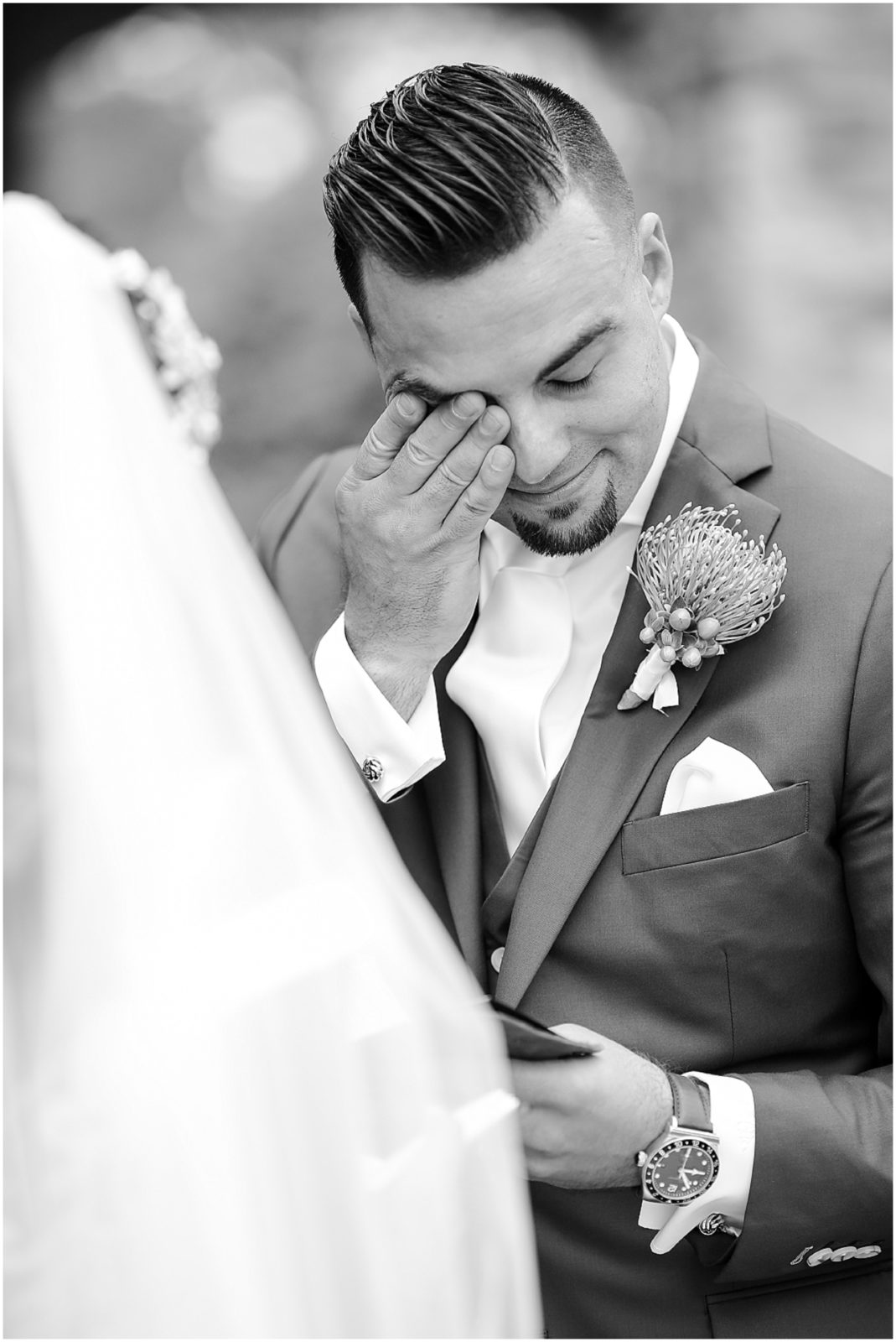 first look with bride and groom - groom is crying - rhapsody  - wiping tears
