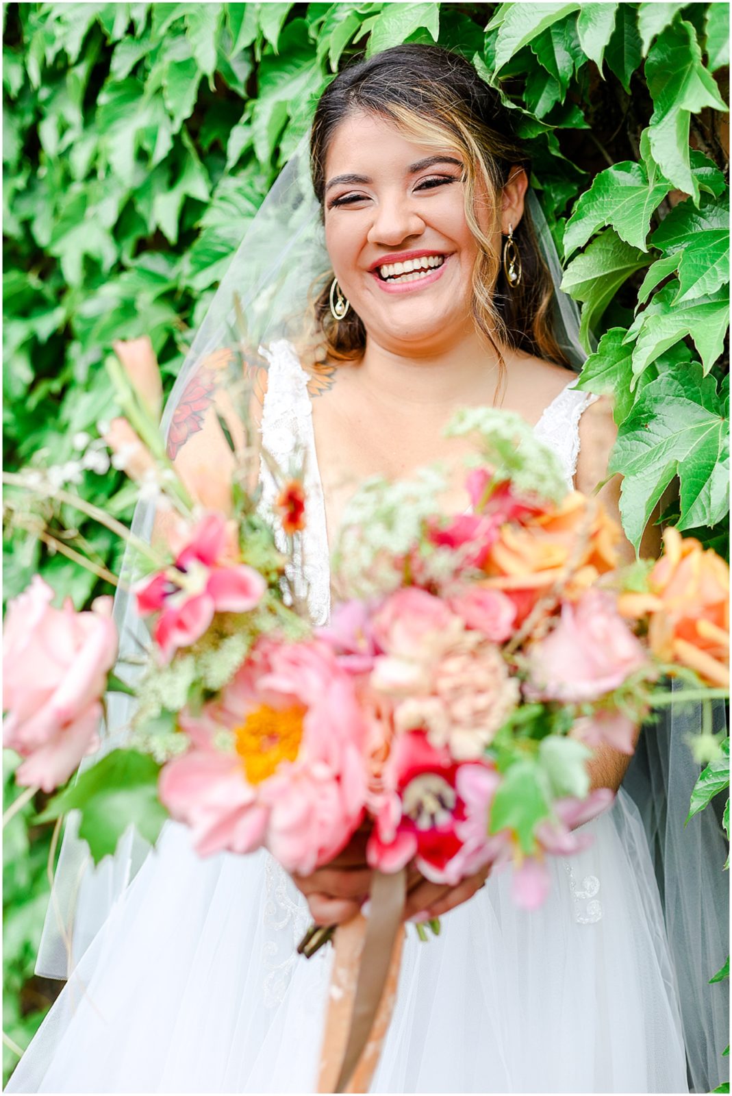 ivy wall with colorful wedding flowers