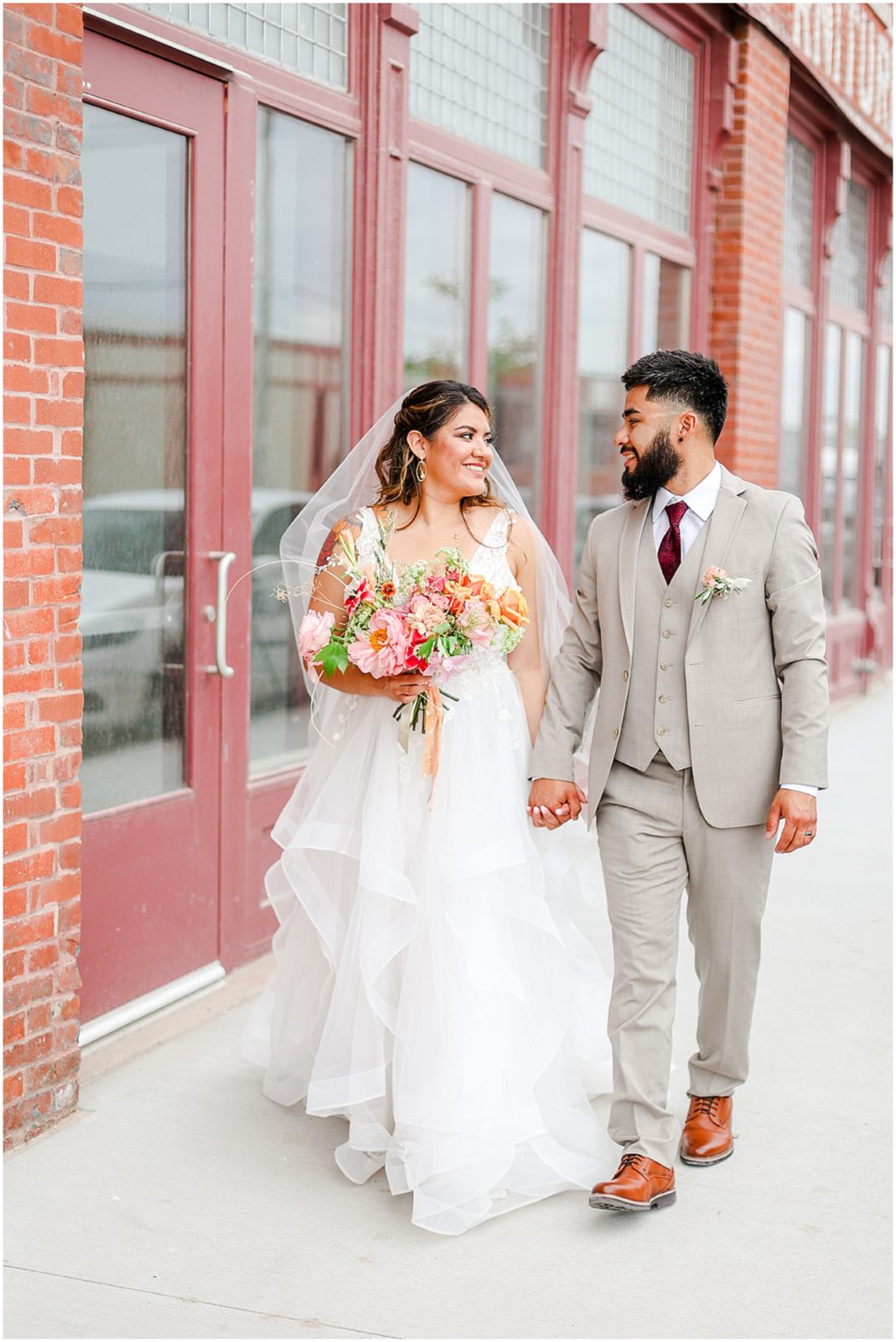 bride and groom walking downtown - where to take photos in kc