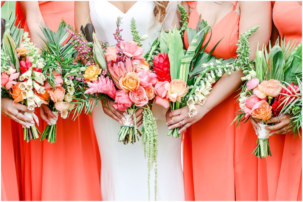 orange bridesmaids dresses -Gorgeous Bride & Groom Wedding Photos taken at the Kansas City Wedding Venue - Rhapsody - by Mariam Saifan Photography - Long Wedding Veil - Lace Wedding Dress - Tropical Wedding Theme 