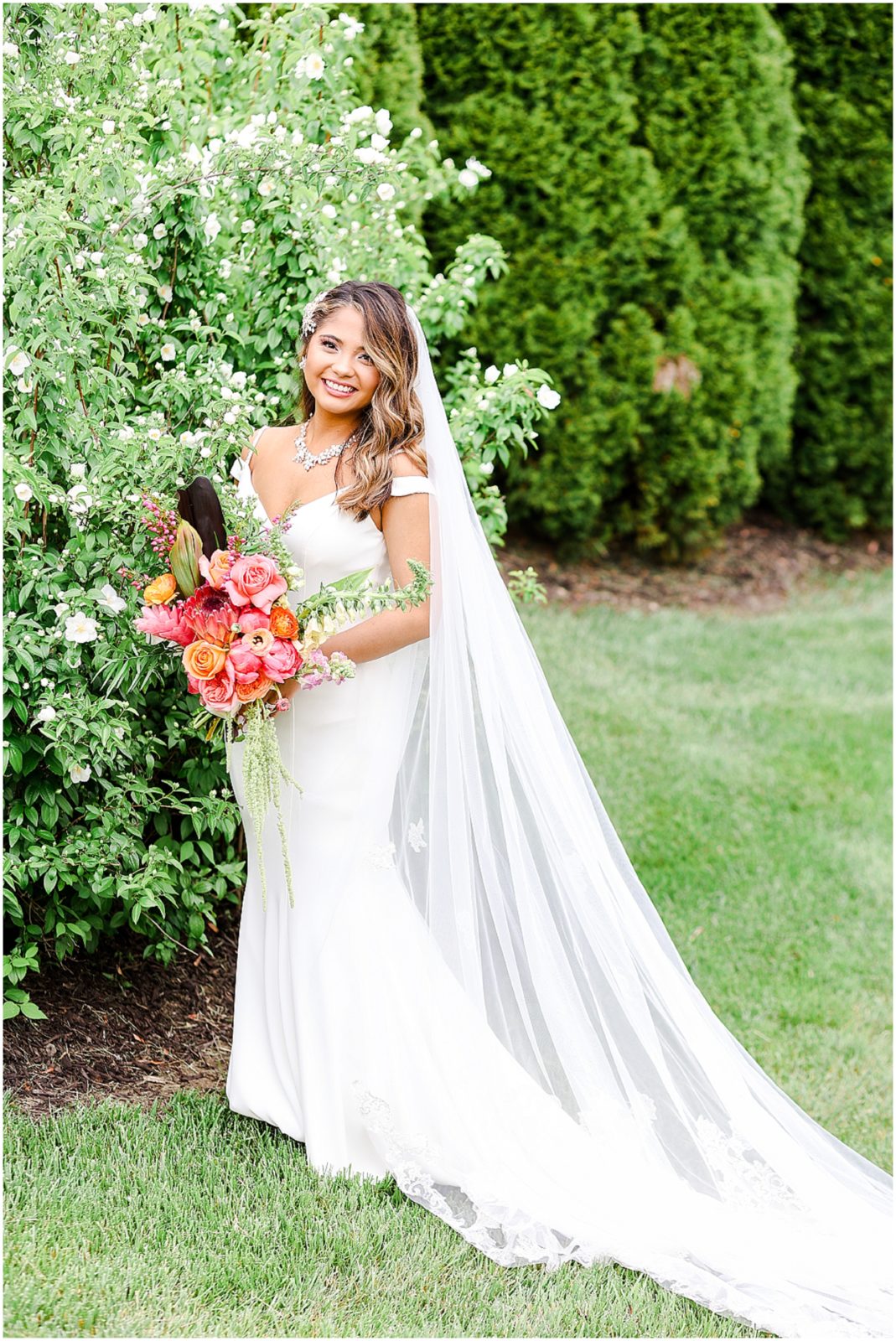 Gorgeous Bride & Groom Wedding Photos taken at the Kansas City Wedding Venue - Rhapsody - by Mariam Saifan Photography - Long Wedding Veil - Lace Wedding Dress - Tropical Wedding Theme