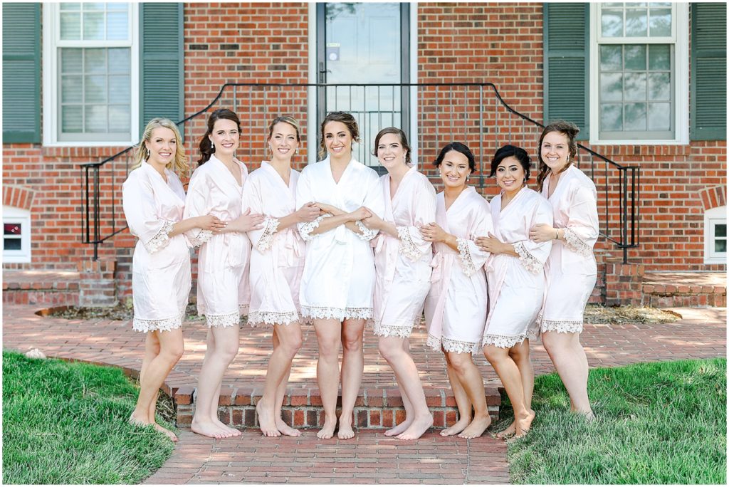 bridal party in robe photos at kansas wedding mildale farms