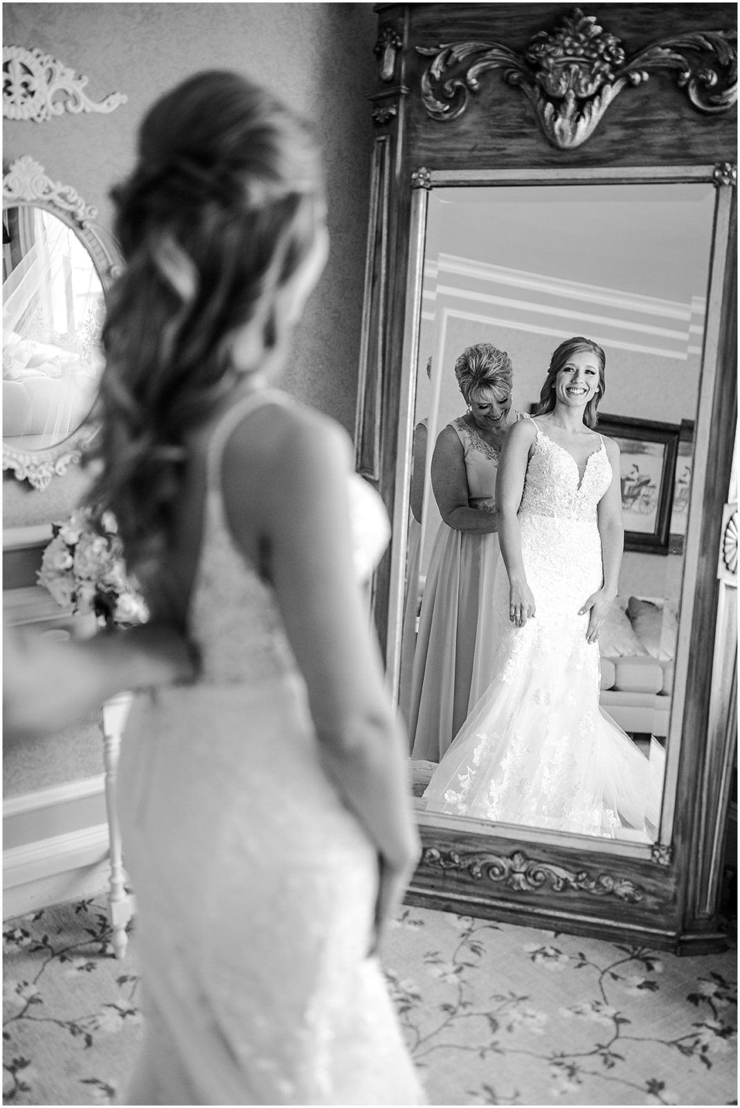 bride getting ready in mirror at longview mansion