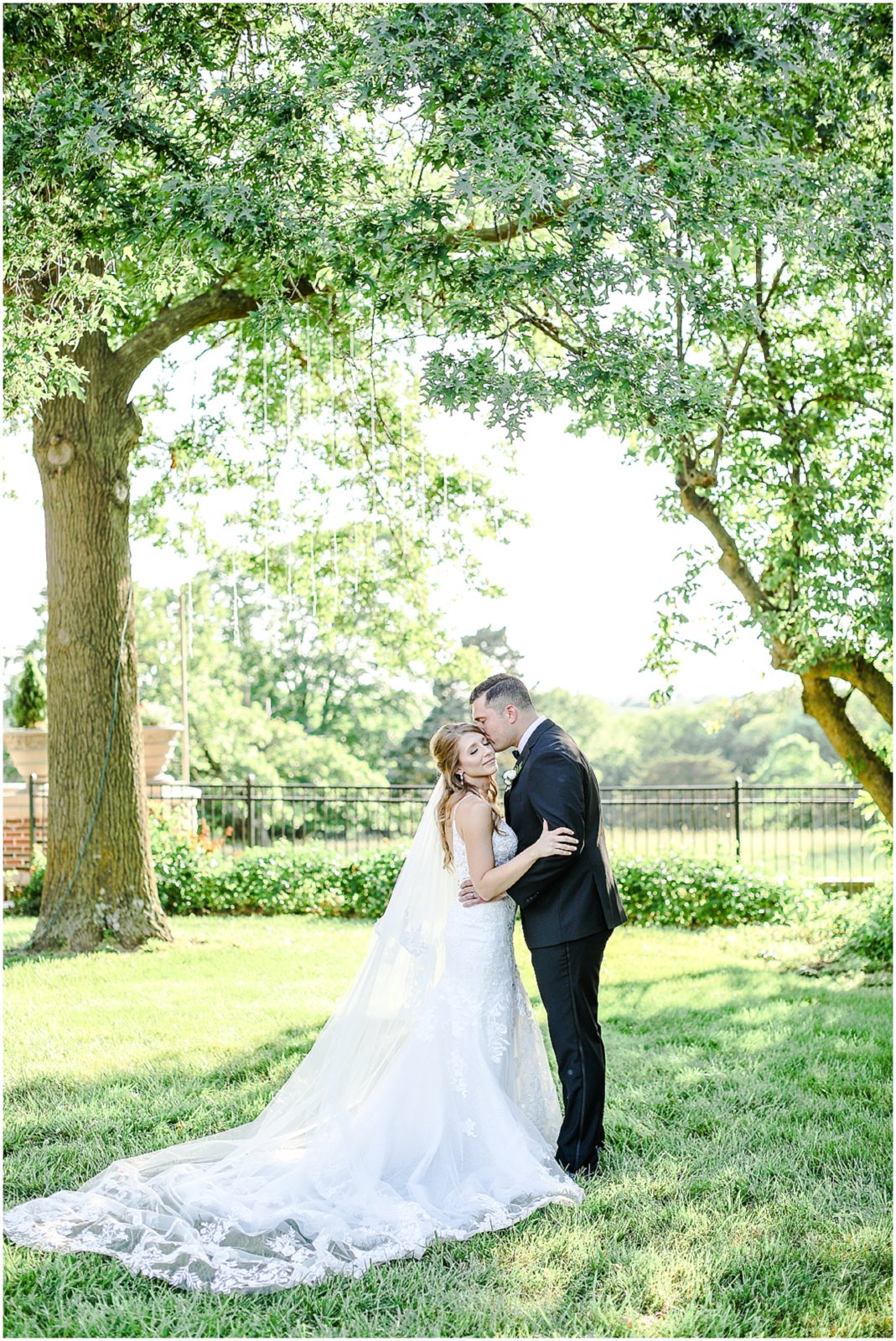 Jamie & Spencer - Summer Wedding at the Historic Longview Mansion - Kansas City Wedding Venues - Mariam Saifan Photography under a tree