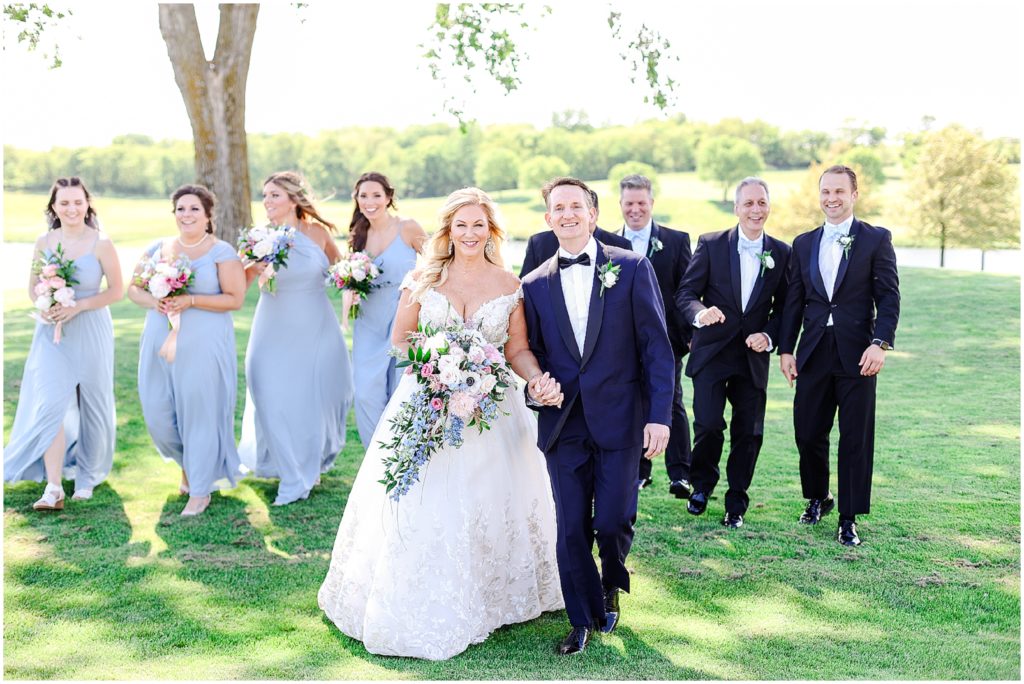 walking bride and groom fun bridal party photos - Lake Mozingo Wedding - Kansas City Wedding Photographer - Beautiful Wedding portraits on a golf course - mozingo golf club - bridal party photos - french themed wedding