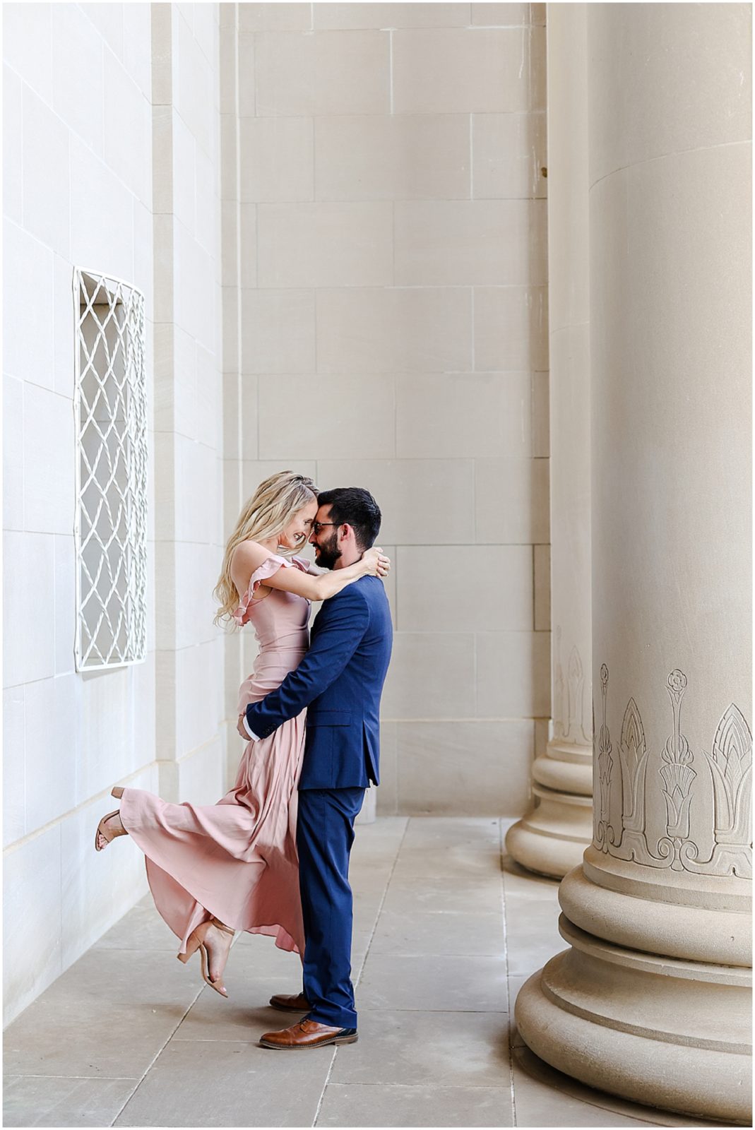 lifting up pose - Kansas City Engagement Photos at the Nelson Atkins Museum  - Where to take Photos in Kansas City - Mariam Saifan Photography - Bethany & Josh - The Longview Mansion Wedding 