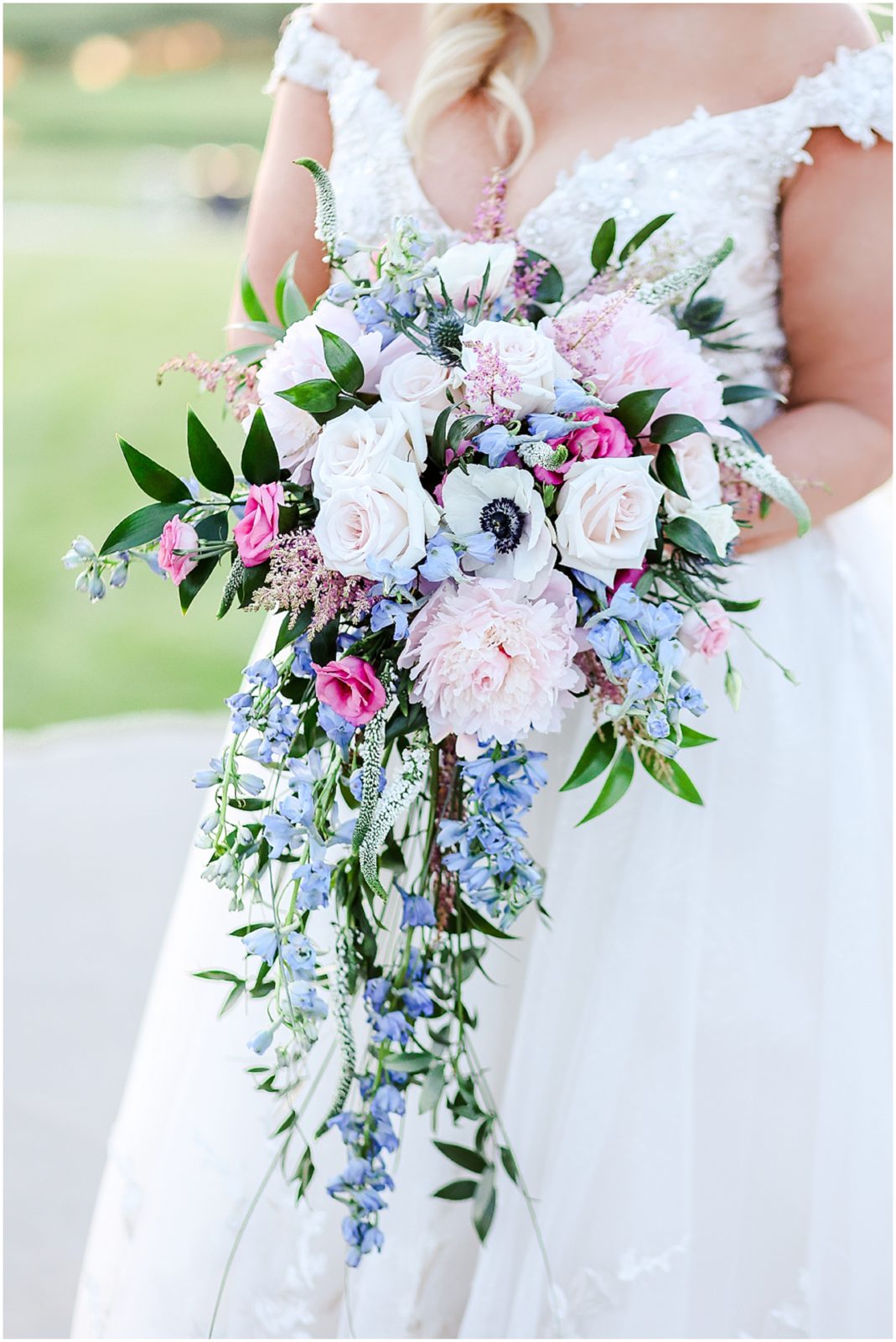 sunset photos with the bride and groom at a golf club - blue and pink wedding flowers bouquet 