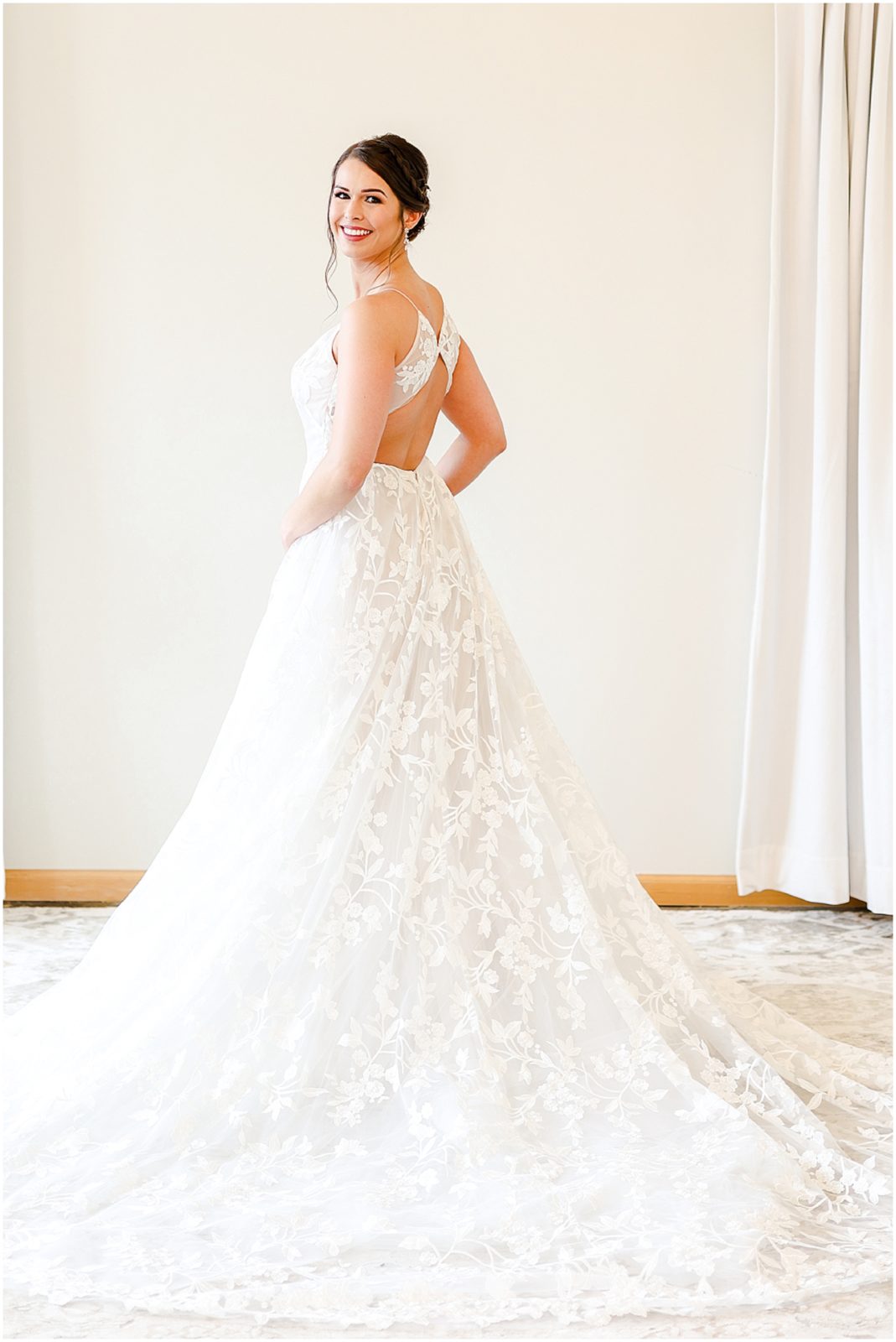 wedding dress - bride looking over her shoulder for wedding photos - Wedding Dress & Shoes & Wedding Ring | Wedding Details | Hello Lovely KC | Bride Getting Ready Photos in Kansas City | Pink Bridal Party Dresses | Altar Bridal Wedding Dress