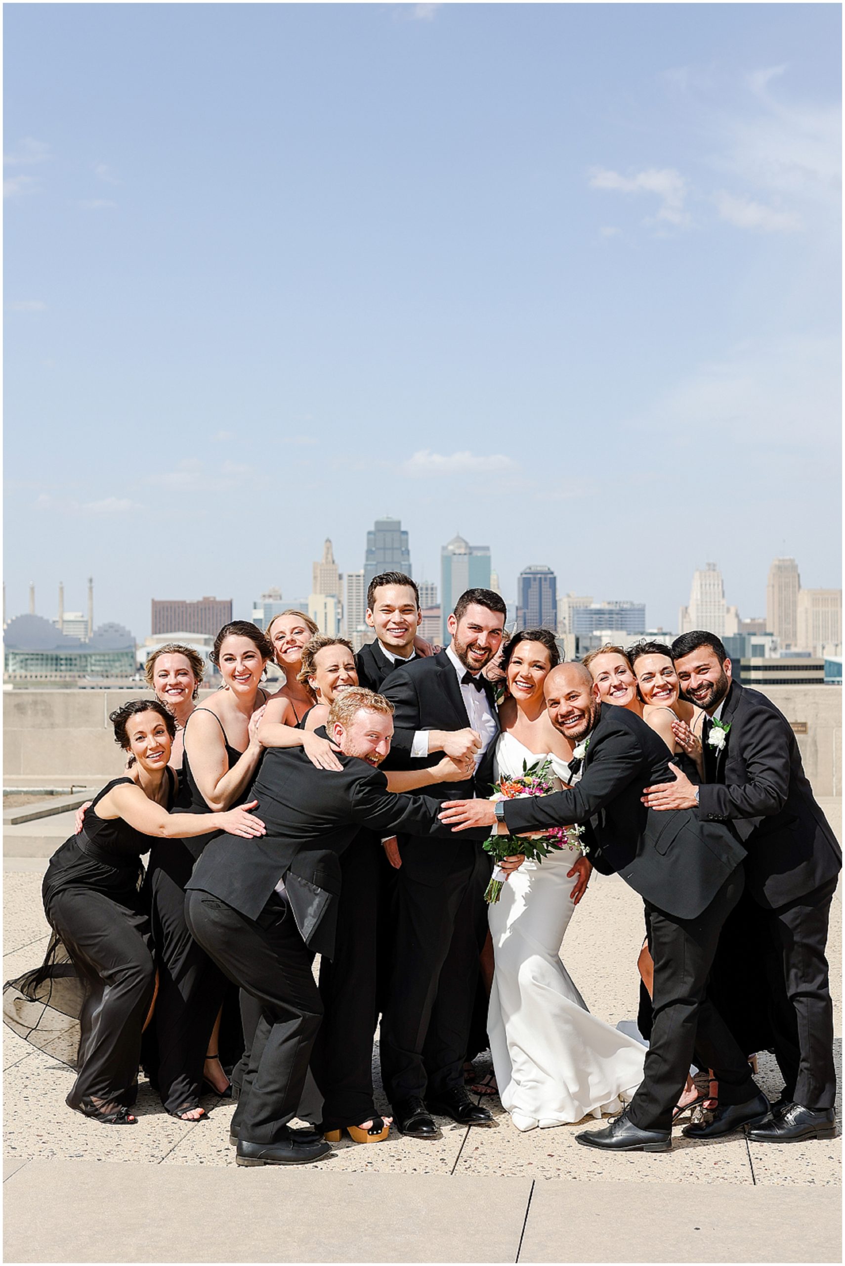 group hug - liberty memorial wedding party - bridal party photo ideas - kansas city wedding photography