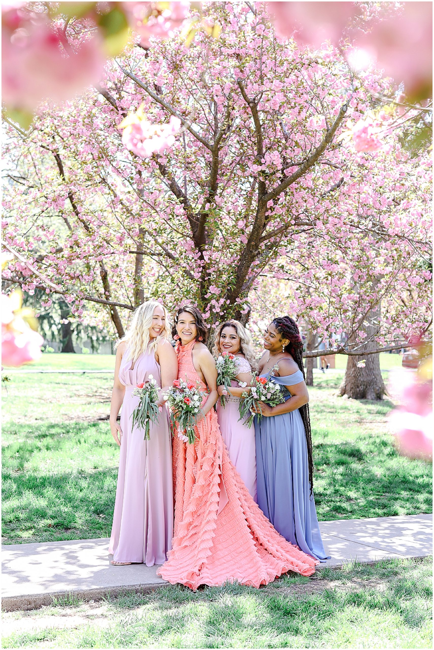 pink wedding dress and beautiful pink trees and kansas city loose park wedding with pretty bridal party photos 