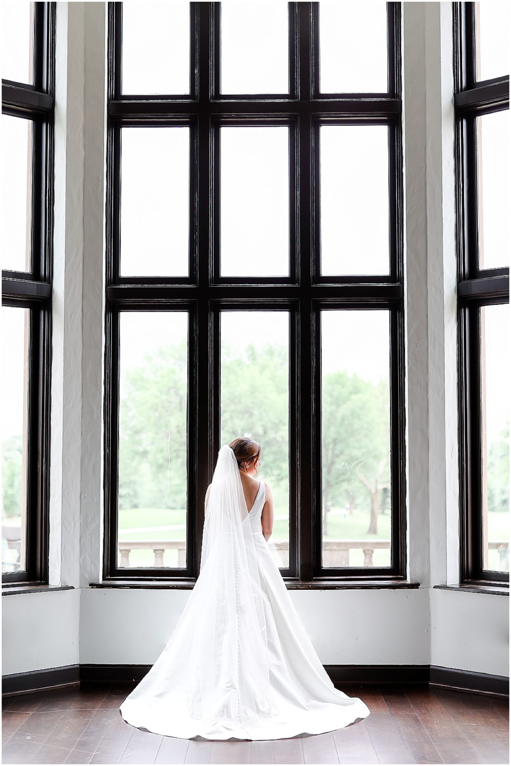 Kansas City Oakwood Country Club Wedding Venue - Wedding Photographer - Kansas City Missouri - Wedding Dress & Wedding Details - Wedding Photo Ideas  - bride with huge windows photo 