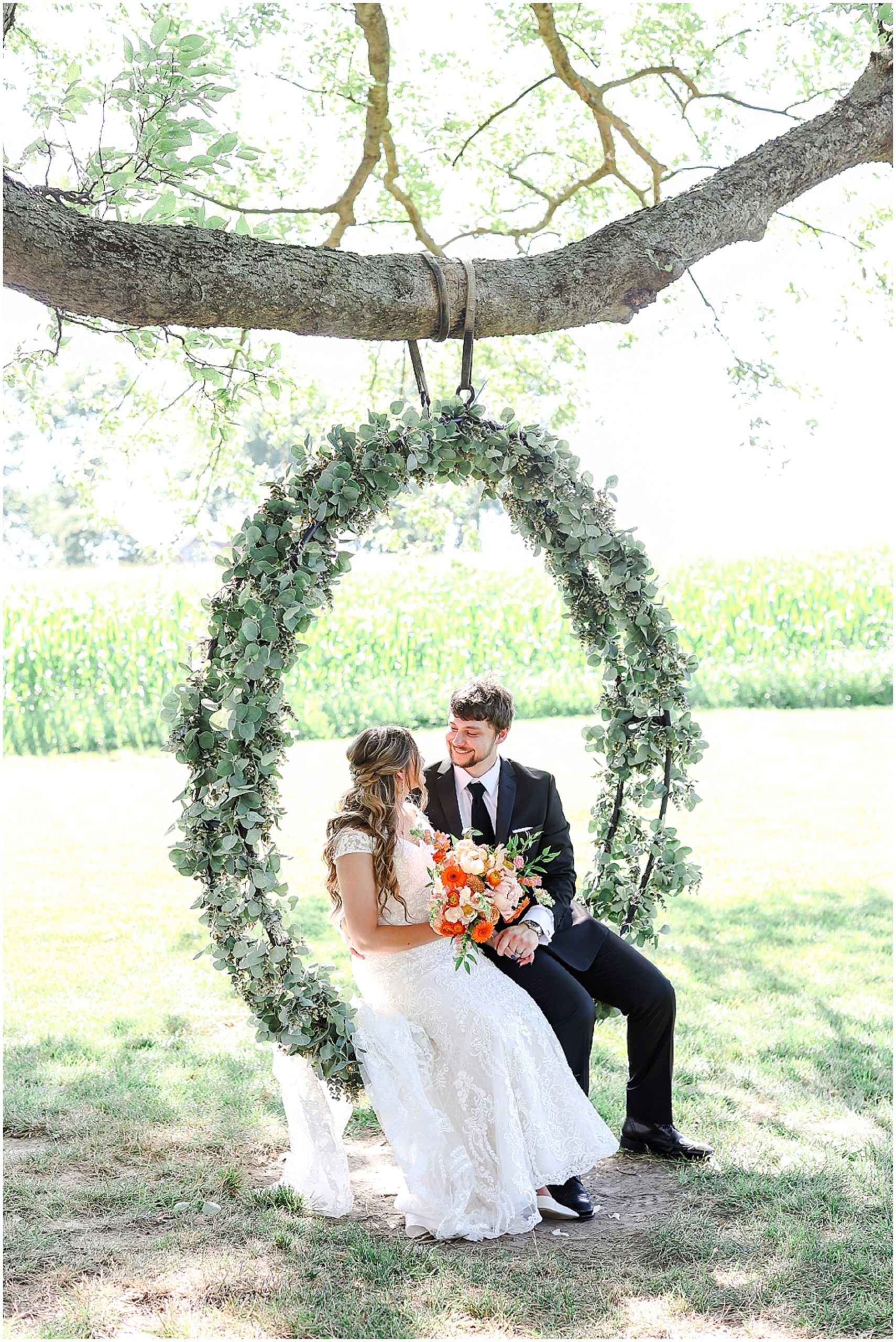 happy colorful wedding photography - light and airy photographer - photography education - photography educator - brownstone topeka - bride and groom at tree 