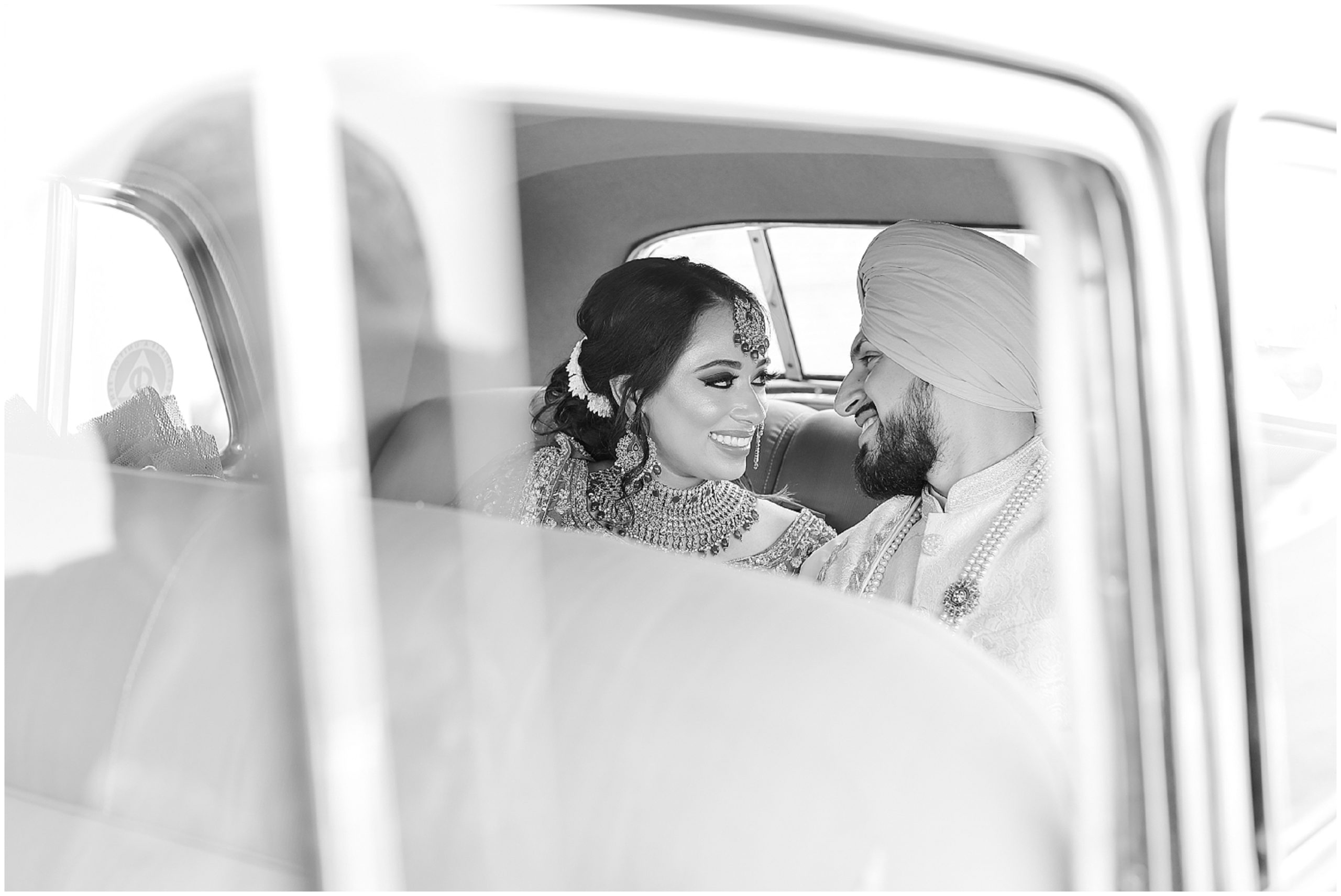 bride and groom in getaway car