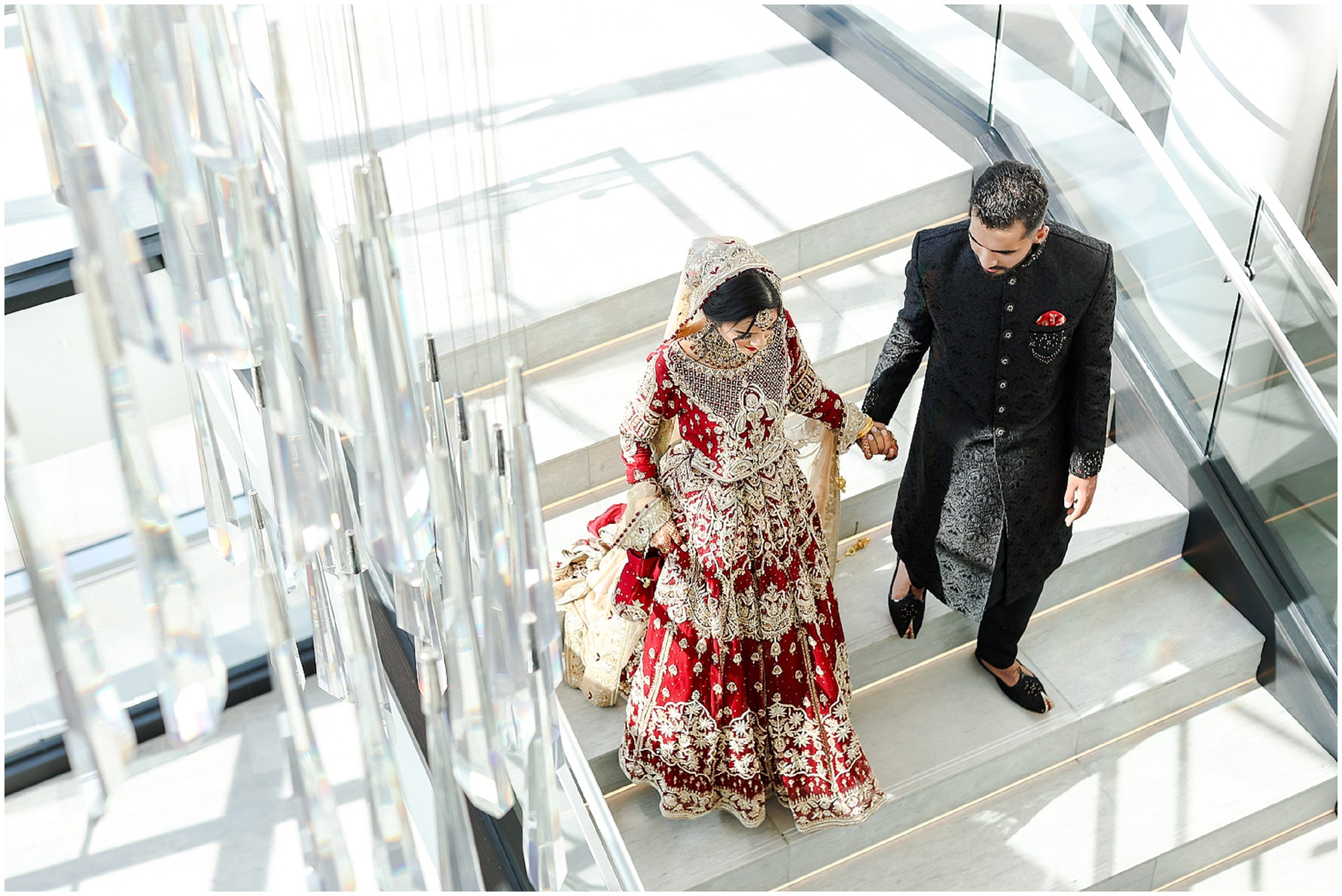 Mariam Saifan Photography - Best Photographer in Kansas City & Overland Park - Pakistani & Indian Wedding - Loews KC - Wedding & Portrait Photography - Bridal Makeup - Gorgeous Bride walking down stairs