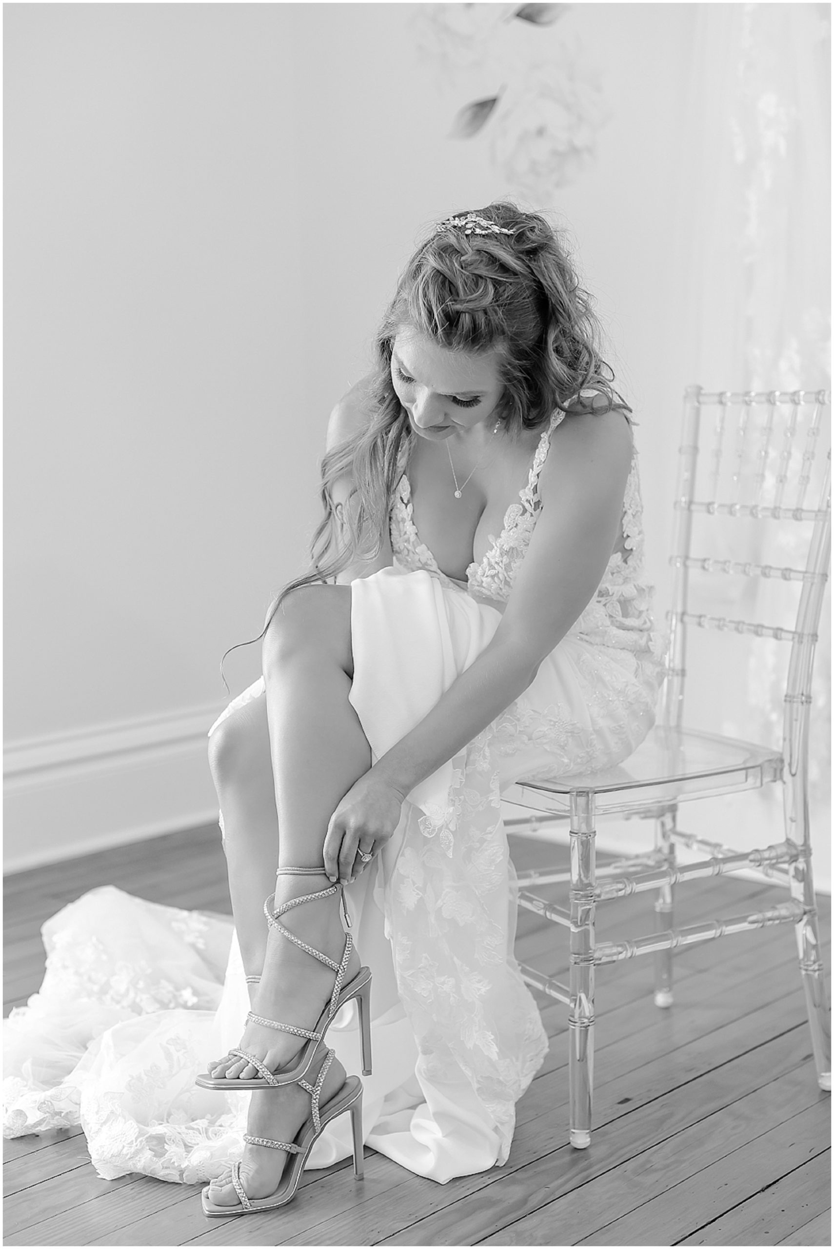 bride putting on her wedding shoes 