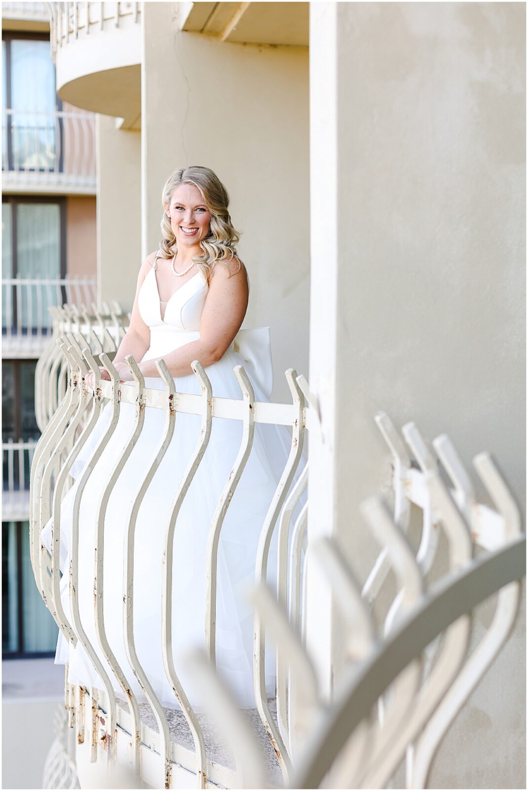 bride looking out balcony at intercontinental hotel kansas city plaza