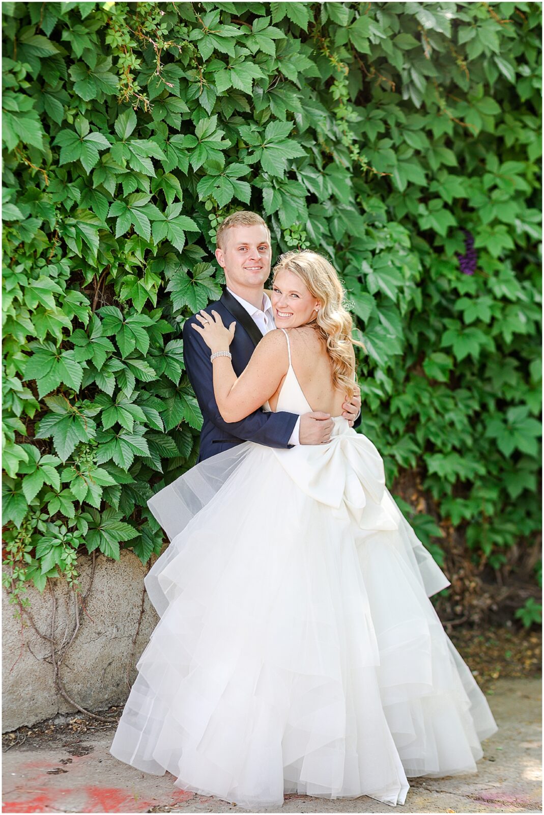 Colorful Summer Wedding in Kansas City at the Loose Park Rose Garden and 2016 Main Wedding Venue | Photos by Mariam Saifan Photography | Kansas City Wedding Photographer | Gorgeous PInk Flowers | Stunning Luxury Wedding Photos | Martha Stewart Weddings | Vogue Weddings | Destination Wedding Photographer | Pink Bridal Party Dresses & Colorful Wedding Flowers  | big bow fluffy wedding dress