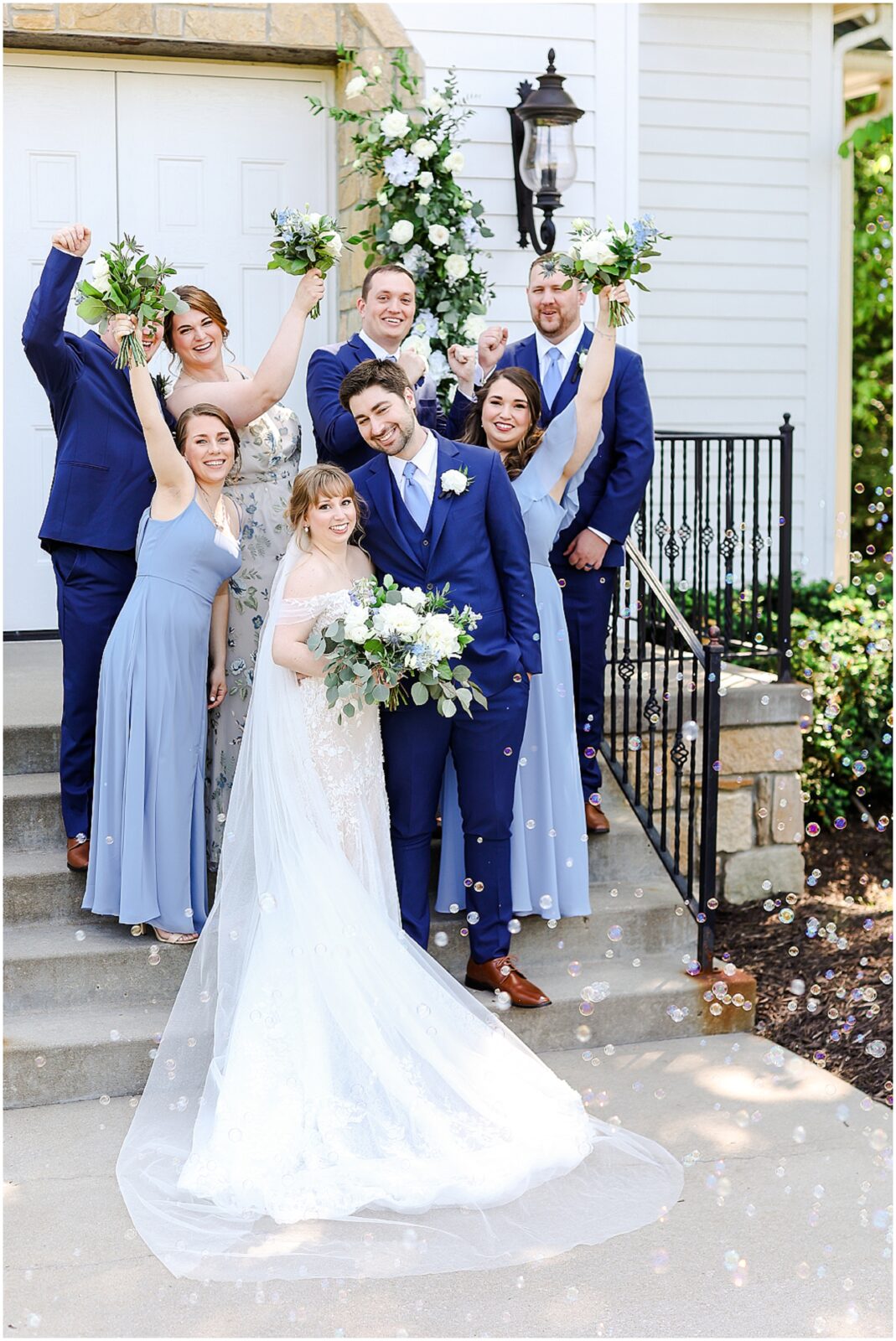 happy bridal party photos at the hawthorne house with blue and white flowers and theme - kansas city wedding photographer mariam saifan